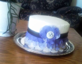 This was a cake that i made for my son?s ?friend?, the cake was covered with almond icing and the petals were made on fondant with lemon flavor