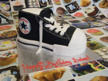 Sponge cake converse shoe, covered in sugar paste, laces in modelling paste.