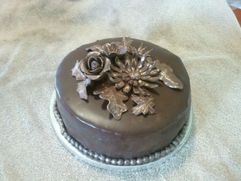 Chocolate cake with modeling chocolate accents