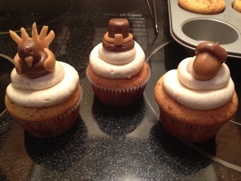 Cinnamon Swirl cupcakes with a Cinnamon buttercream and Thanksgiving toppers made out of tootsie rolls and caramels!