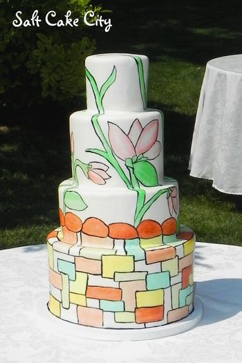 Hand-painted stained glass wedding cake. It was modeled after another cake the bride had seen. I used marshmallow fondant to cover the cake and then hand-painted the design with food coloring.