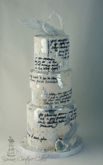 This was a cake I made last year for Valentine's Day. Handwritten love letter (provided by client for his sweetie), isomalt details, gum paste ruffly hearts, rice paper feathers, rock candy, silver gilding