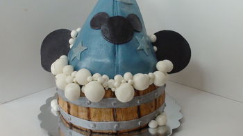 www.thecrumbcoat.wordpress.com I made this cake for my little guy's 4th birthday. The hat is cake covered in mmf, ears are modeling chocolate, bubbles and wood panels are also mmf.