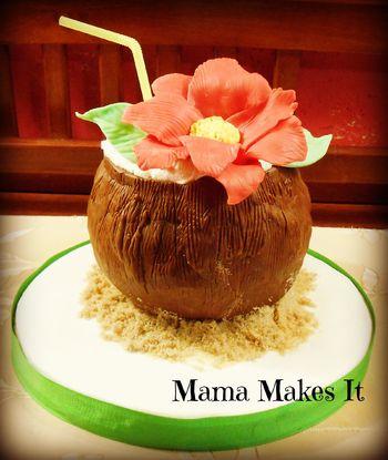 This was one of the two cakes I made for our local food bank dessert auction. It was a Hawaiian themed dessert. Almond Joy cake-chocolate almond cake with coconut filling and coconut Swiss meringue buttercream. It is covered in modeling chocolate. The flower is also made out of modeling chocolate. Sand is brown sugar. I loved how it turned out!