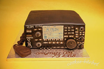 i made this Ham-Radio for my dad´s birthday. it is 3 layers of baileyscake filled and frosted with mokka-bc. then covered in choc-fondant and painted black. the mic and the cable are made out of modeling-choc. TFW!