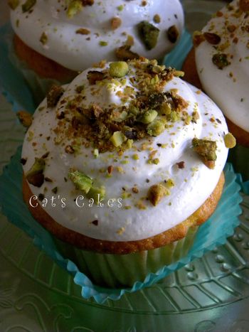 Yellow cake cupcakes filled with Pistachio creme topped with soft butter cream and sprinkled with roasted salted pistachios.