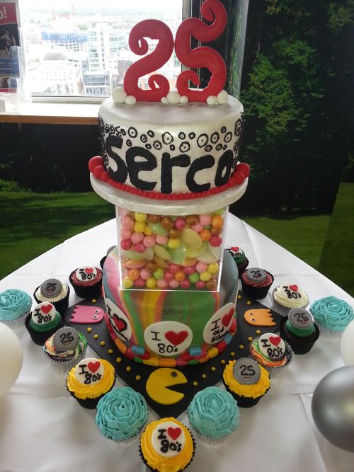 My first chargable order, this was for a company's 25th anniversary/man nesters 80's themed night. Two tier cake with 75 cupcakes :-)
