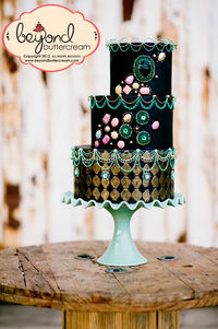 Honored to have been put on the cover of the March 2013 issue.  This is a mish mash of stringwork techniques. gumpaste gems, isomalt gems, embossing and handpainting.  I LOVE this cake.
