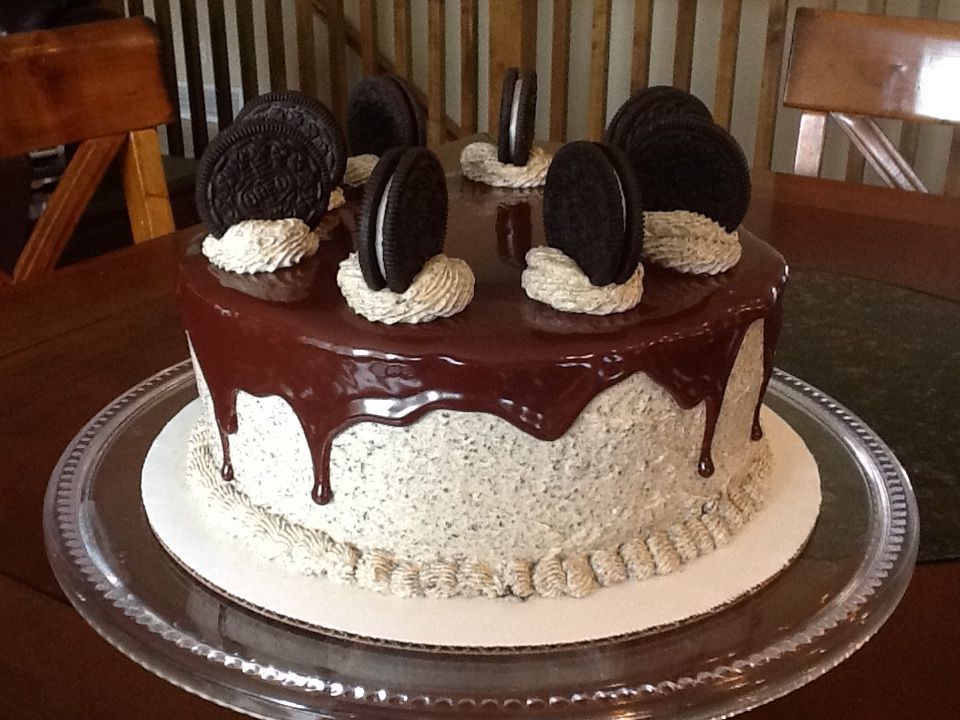 Chocolate cake with oreo French buttercream, ganache glaze, and more oreos on top!