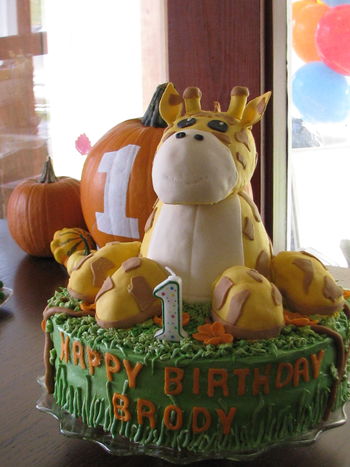Our grandson's 1st Birthday cake.  The giraffe was made out of Rice Krispie treats.