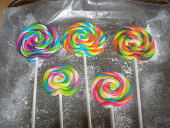 These lollipops are for a Candy Shoppe Theme cake I am doing in two weeks.  They are made with MMF and Tylose powder added.  I am so happy with the way they came out.