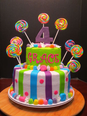 I had so much fun doing this bright and colorful birthday cake.  All the accents are made from MMF.  I love the lollipops and "wrapped candy".  The base of each cake is MMF gumdrops and the wrapped candy.