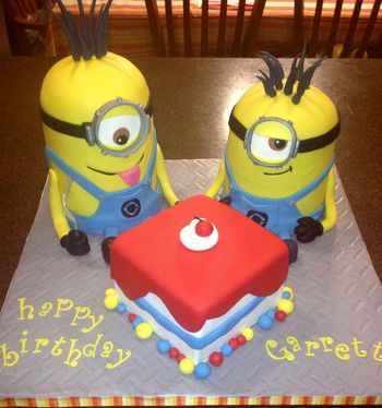 Two minions and a cake - thank you to all the cc'ers before me for creating such a CUTE cake!! The minions are 6in rounds, with a 1/2 ball pan on top.  I used SPS plates as dividers but used a dremel to reduce the size of the SPS plates.  The square is a 6in as well.  Diamond Plate impression mat on the cake base