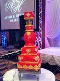 My first wedding cake EVER.  It happened to be for an Indian wedding.  The bride wanted to match her outfit to the cake which gave me the basis for color and design of the wedding cake.