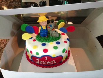 Caillou themed birthday cake.  10 inch peanut butter and jelly cake.