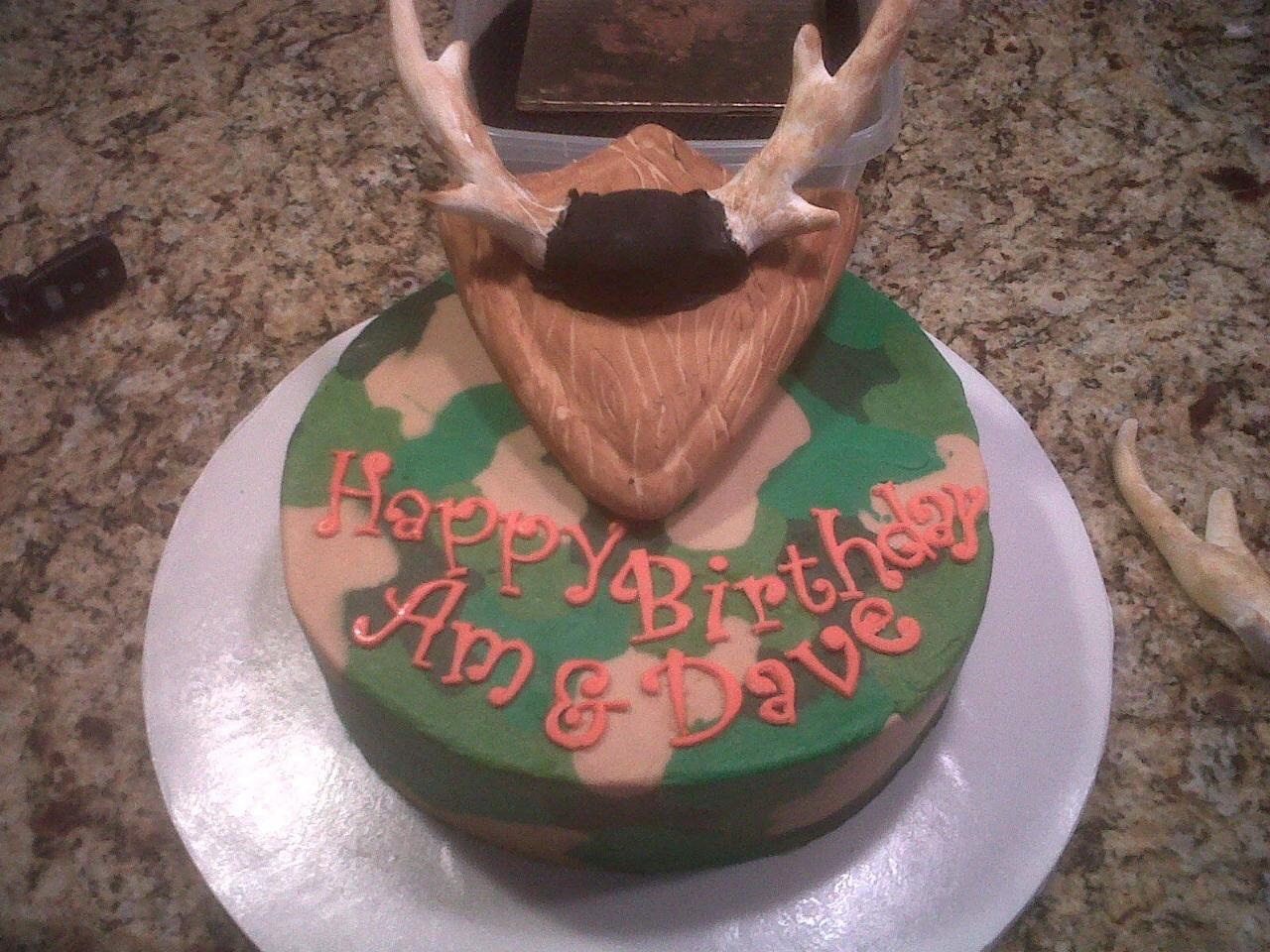 Camo cake done in buttercream technique learned on cc Rice Krispie plaque covered in fondant with gum paste antlers