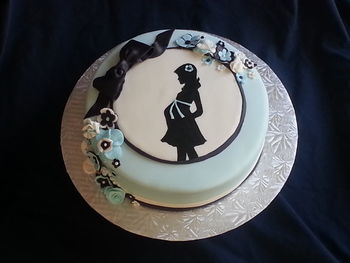 Chocolate cake with vanilla buttercream and marshmallow fondant..  Silhouette is hand painted with marshmallow fondant details.