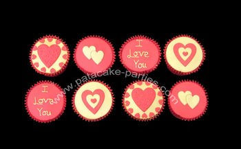 Red and gold Valentine's Day cupcakes... Light and fluffy vanilla sponge cupcakes, filled with a vanilla buttercream and then topped with sugarpaste.