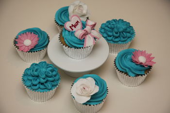 Vanilla cupcakes with blue vanilla buttercream.