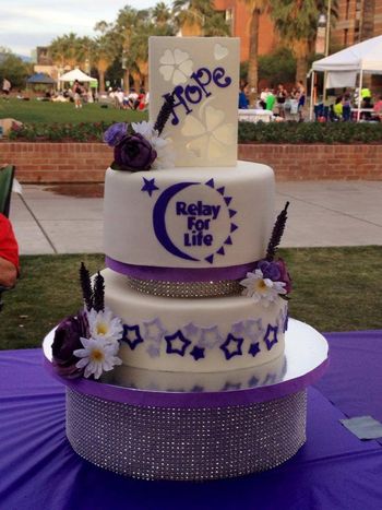 It was an honor to create this cake for the Survivor's Dinner at University of Arizona's 2014 Relay for Life.  The top is a gumpaste luminaria with a battery operated tea light inside, the rhinestone base is a cake dummy.