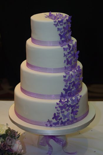 A cascade of purple gumpaste butterflies.