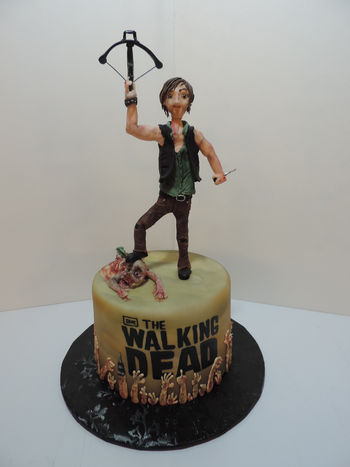 This cake featuring Daryl Dixon from The Walking Dead is a special one for me. It was for my wife and I to present to Norman Reedus at a Comic Con appearance he was making. Not only did he LOVE the cake, but took pictures with it all day, as well as pics with his phone of it. It may even make an appearance in an upcoming book of fan art he is releasing!! Awesome!!